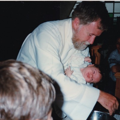 1996 Father Rick Mcknight baptising Nicholas Gallant (Terry and Susan's son) 