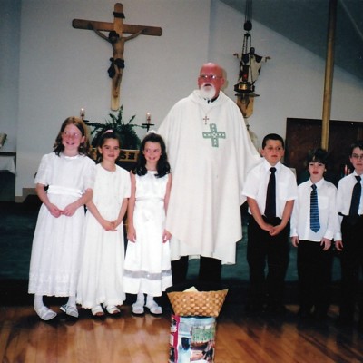 2003 first communion Mykayla Mcneil, Bailey Simpson, Paige Larkin, Father Leo Trainer, Matthew Reid, Connor Simpson, Bradley Macfarlane