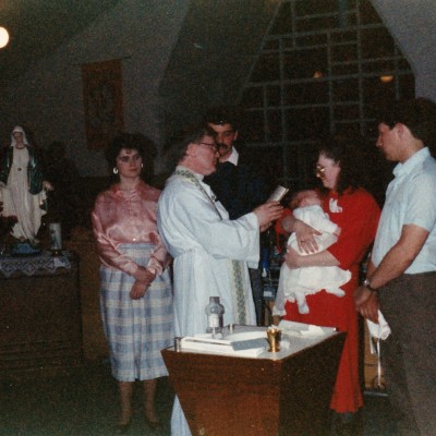 1985 David Longuepee's baptism Father Bradley and Terry and Evelyn Doiron god parents